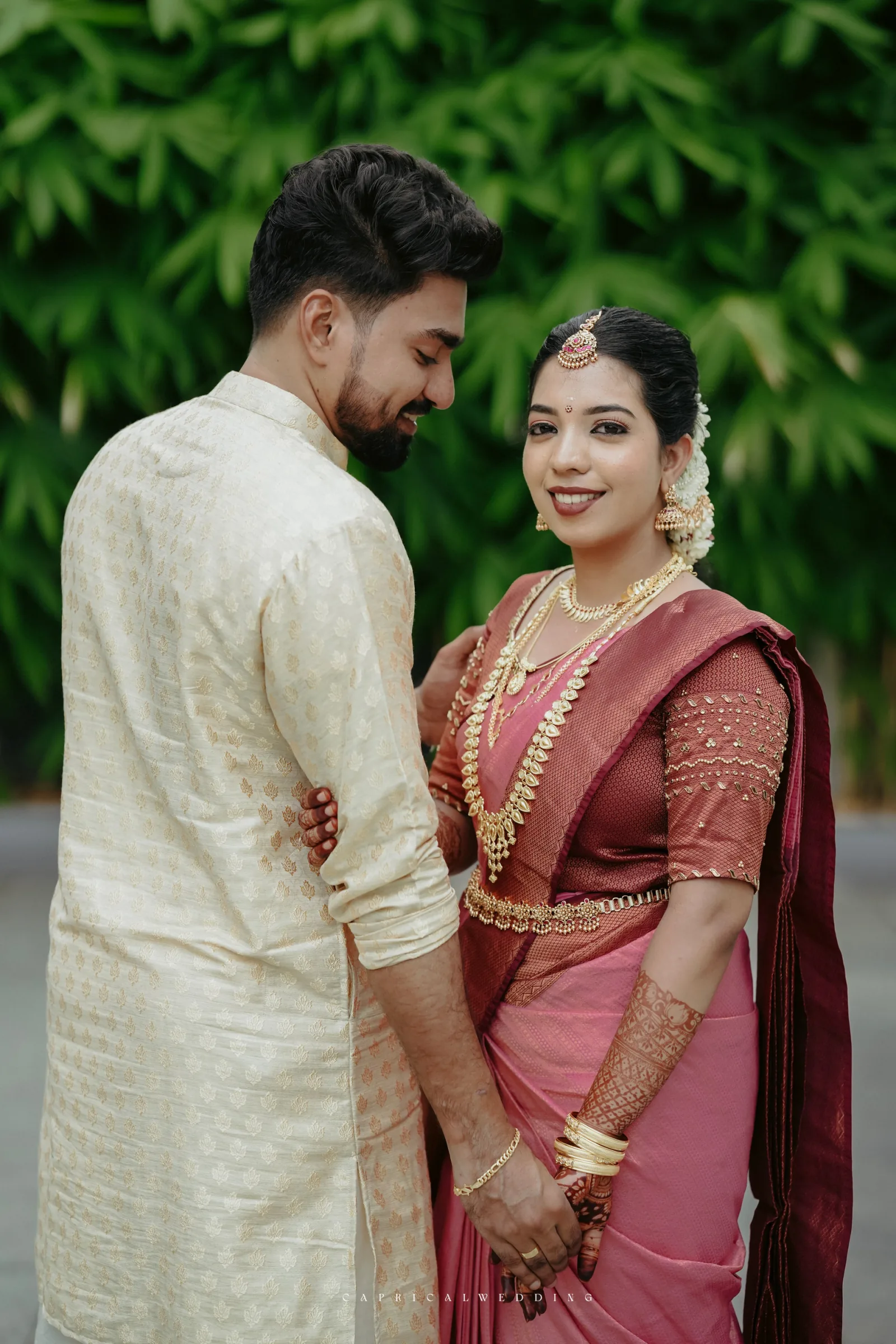 A couple in a light-filled wedding portrait